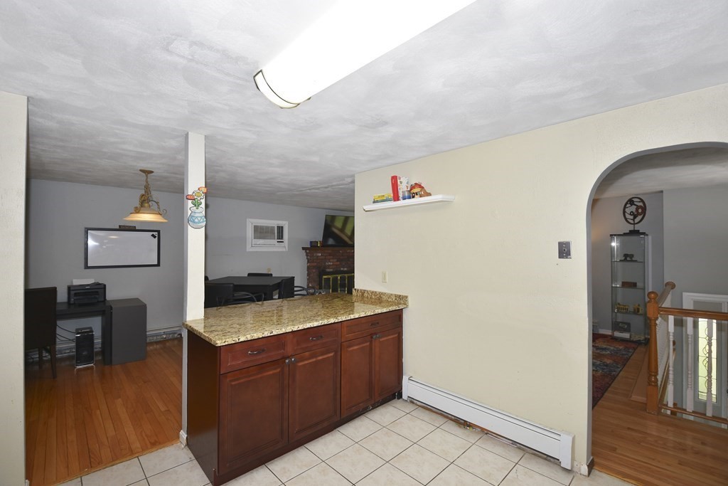 39 Tanglewood Road Sterling, MA 01564 - Photo 9 of 30 a kitchen with a refrigerator and a stove top oven