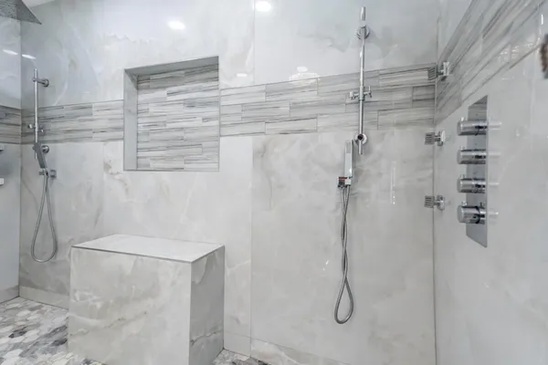 a bathroom with a glass shower door