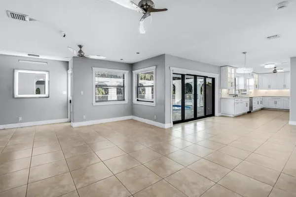 a view of an empty room with a window
