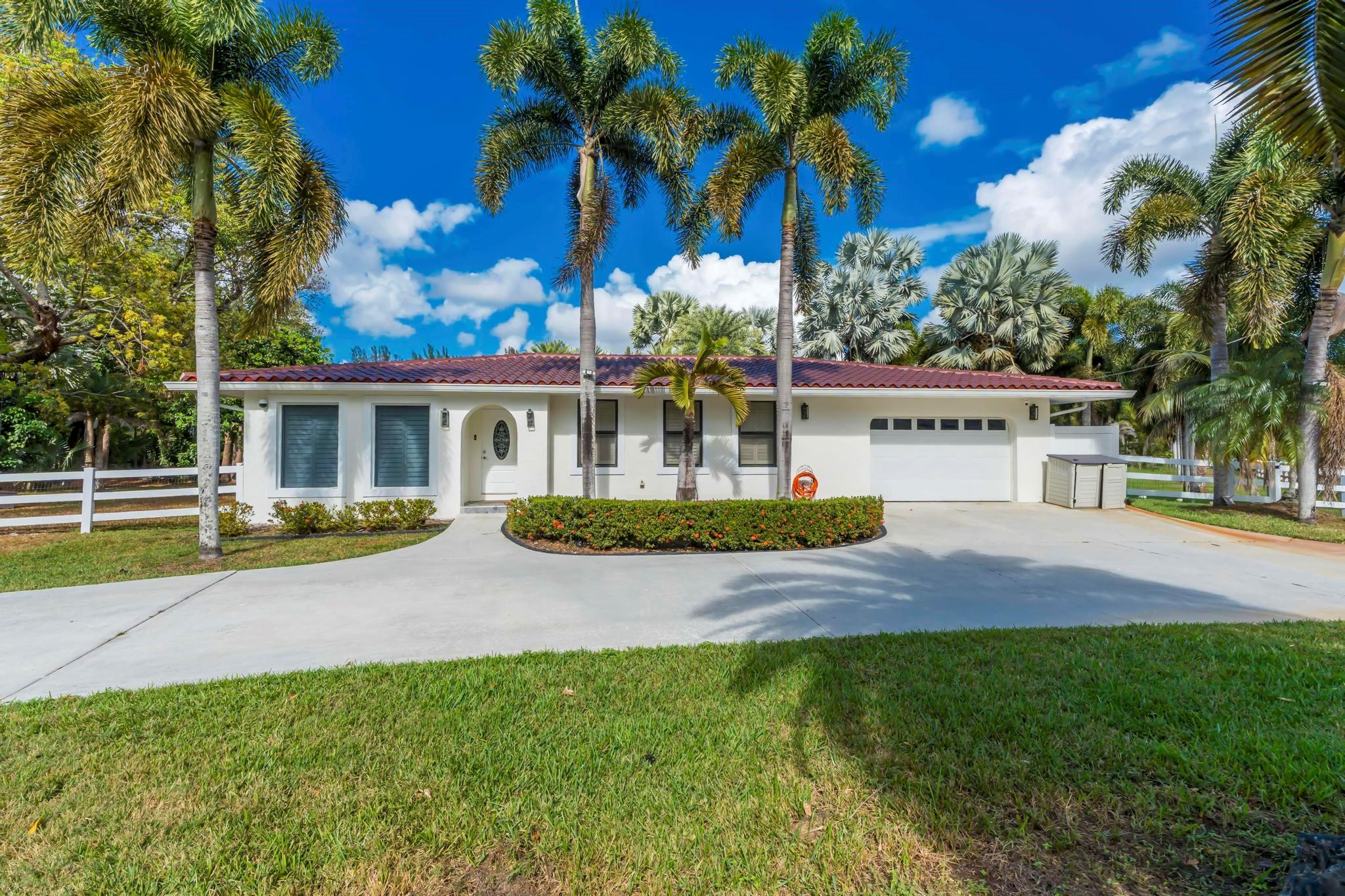 18201 Southwest 70th Place Southwest Ranches, FL 33331 - Photo 2 of 55 a view of house with outdoor space and swimming pool
