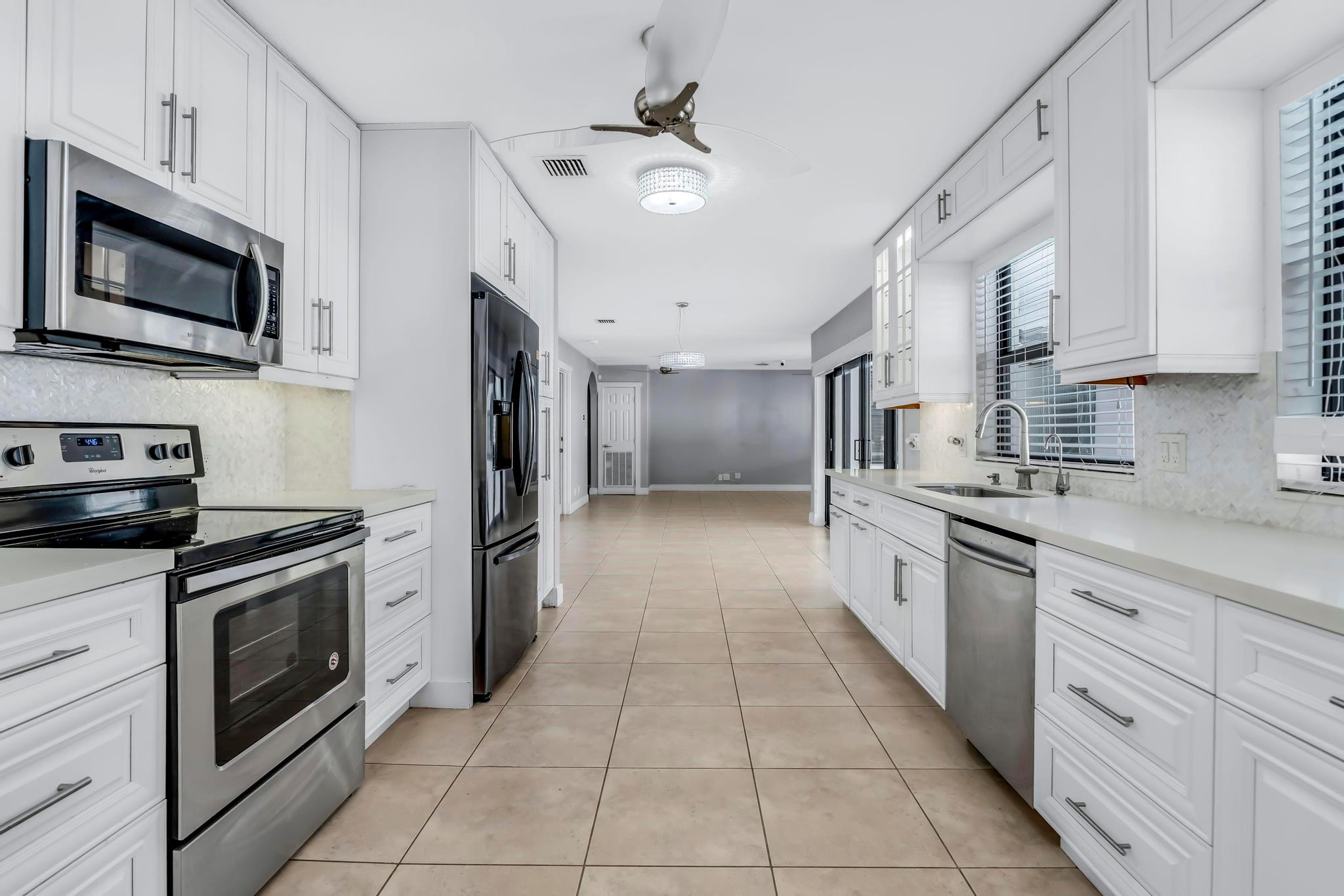 18201 Southwest 70th Place Southwest Ranches, FL 33331 - Photo 21 of 55 a large kitchen with cabinets stainless steel appliances and a counter space