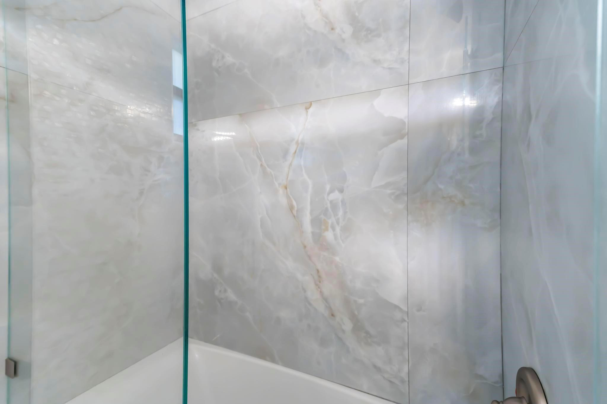 18201 Southwest 70th Place Southwest Ranches, FL 33331 - Photo 23 of 55 a bathroom with a glass shower door