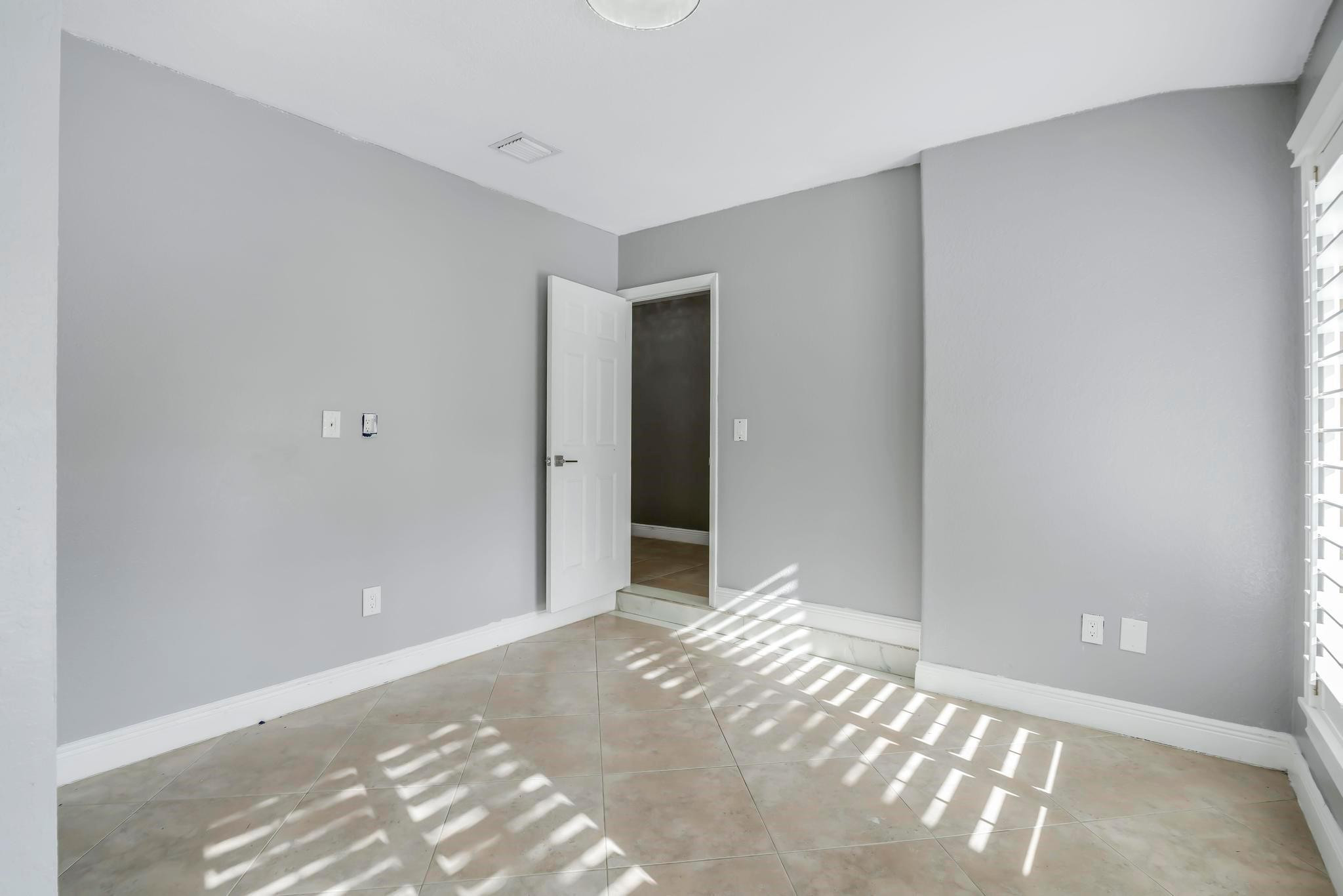 18201 Southwest 70th Place Southwest Ranches, FL 33331 - Photo 30 of 55 a view of a big room with wooden floor and a bathroom
