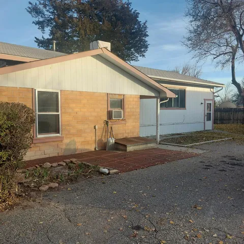 a view of a house with a yard and plants