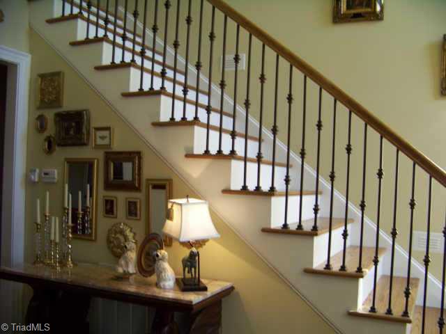 1387 Abbotts Creek Church Road High Point, NC 27265 - Photo 2 of 9 Other. The iron railing goes up to the second level featuring 3 bedrooms with adjoining baths plus a 30x15 bonus room with closet that could be 5th bedroom.