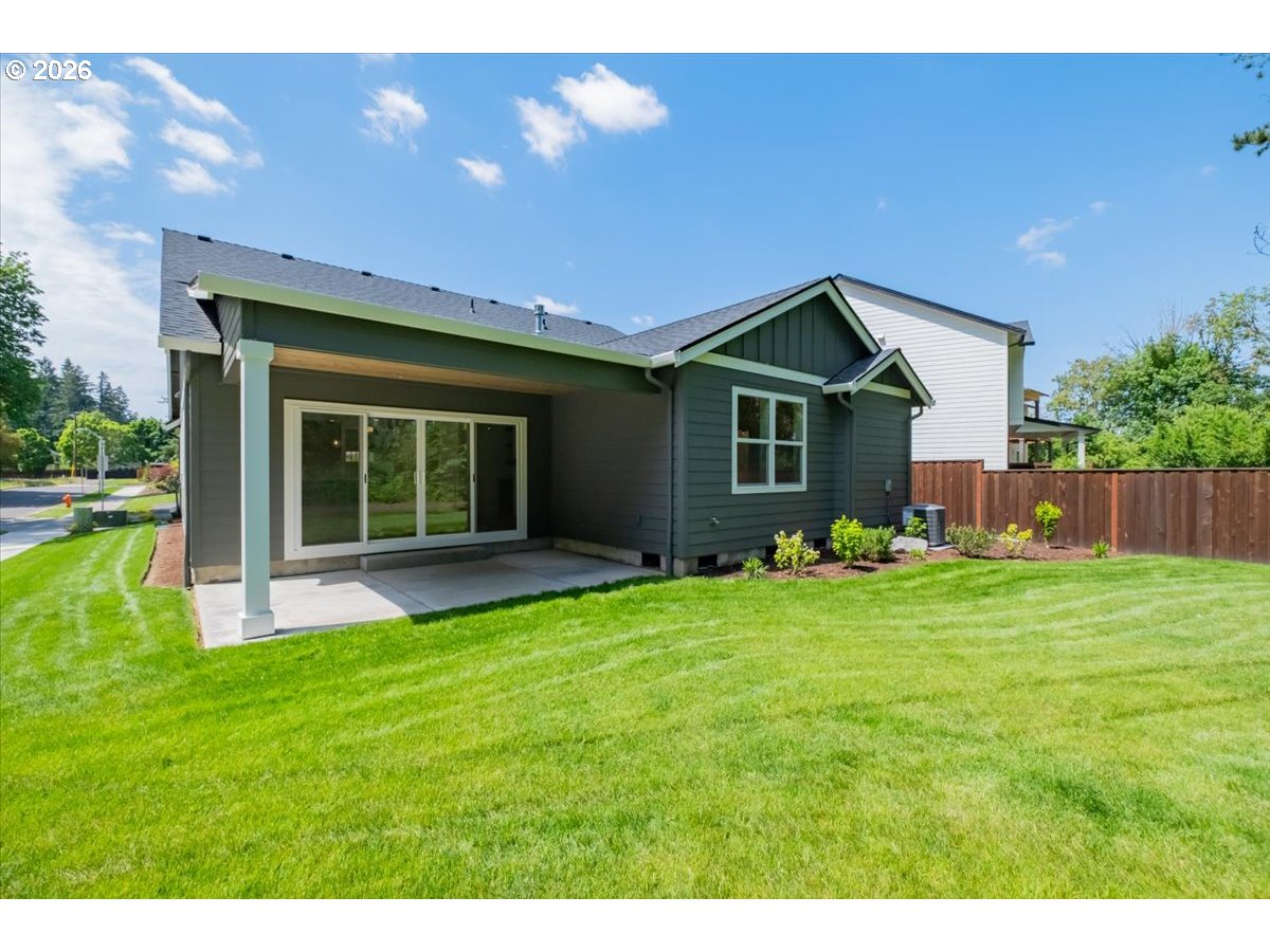 2147 Northeast Spitz Road Canby, OR 97013 - Photo 44 of 48 a front view of a house with a yard and garage