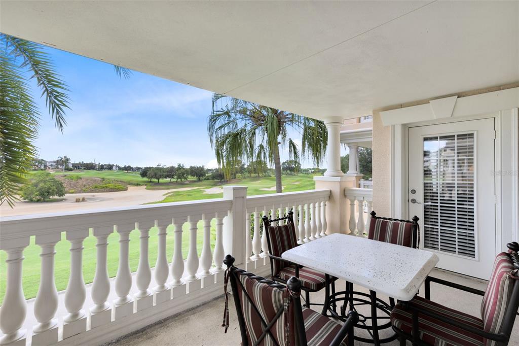 1360 Centre Ct Ridge Drive, Unit 201 Reunion, FL 34747 - Photo 7 of 29 a view of a patio with wooden floor