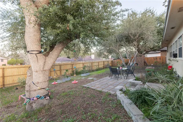a view of backyard with sitting area and garden