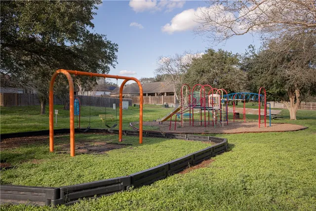 a view of a park with swings