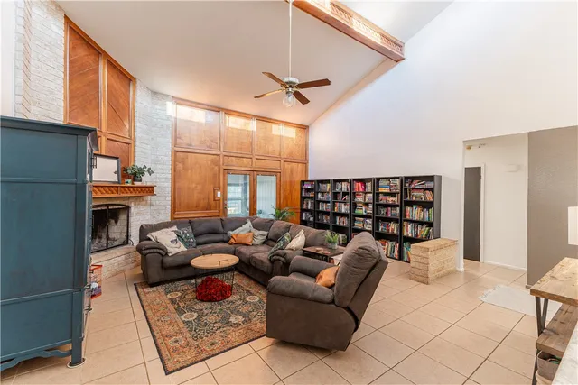 a reading room with furniture a rug and a window