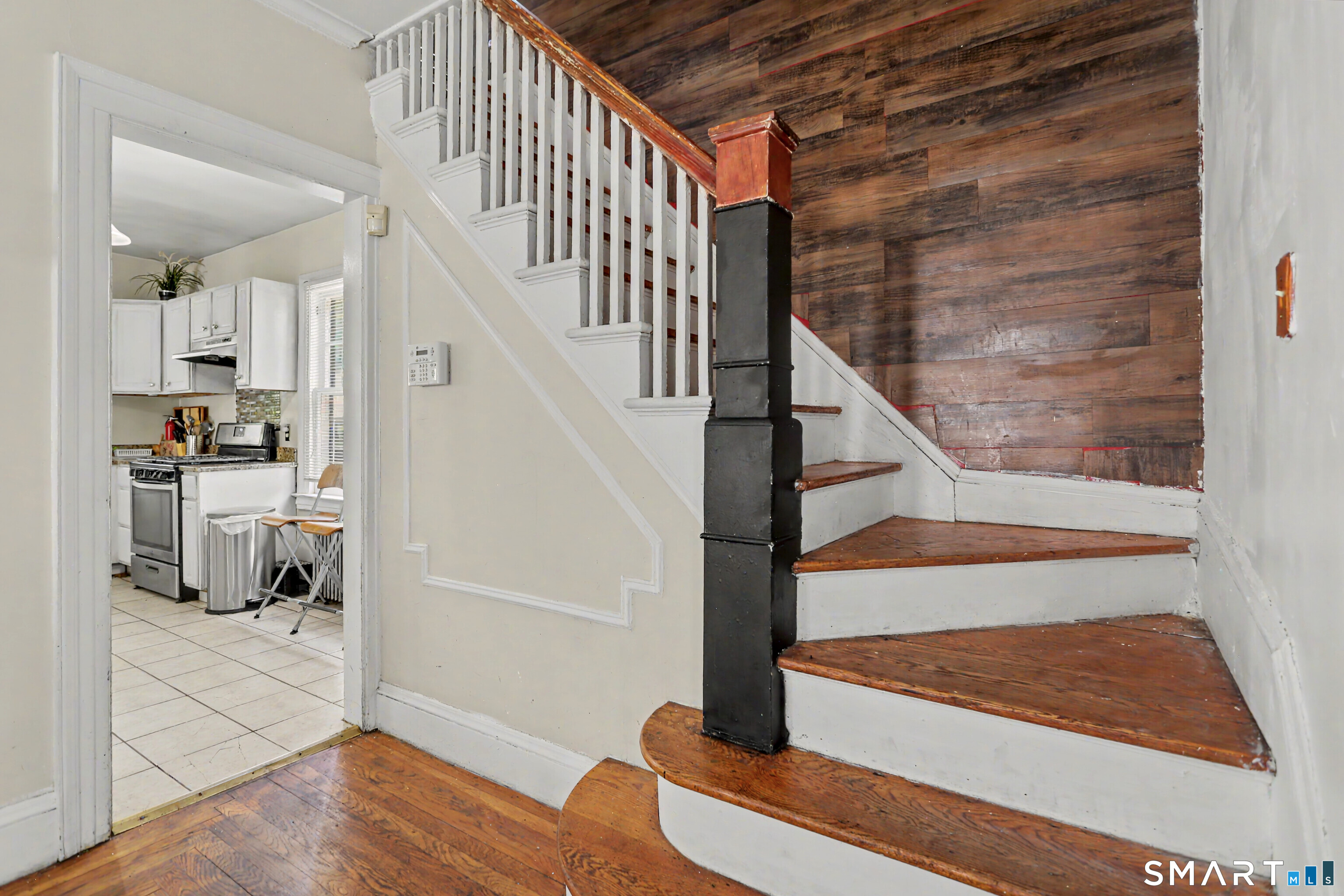 94 2nd Street Hamden, CT 06514 - Photo 17 of 31 a view of entryway and hall with wooden floor