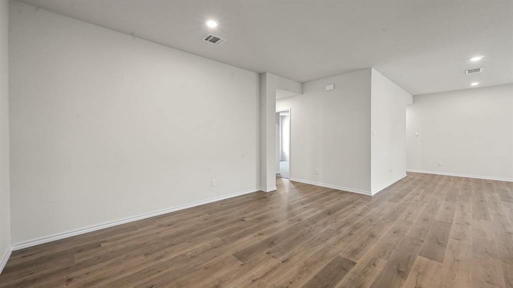 6088 Freedom Drive Lindale, TX 75706 - Photo 20 of 40 a view of an empty room with wooden floor
