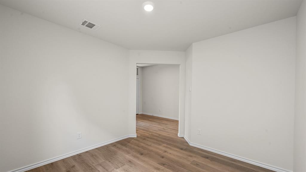 6088 Freedom Drive Lindale, TX 75706 - Photo 23 of 40 a view of an empty room with wooden floor