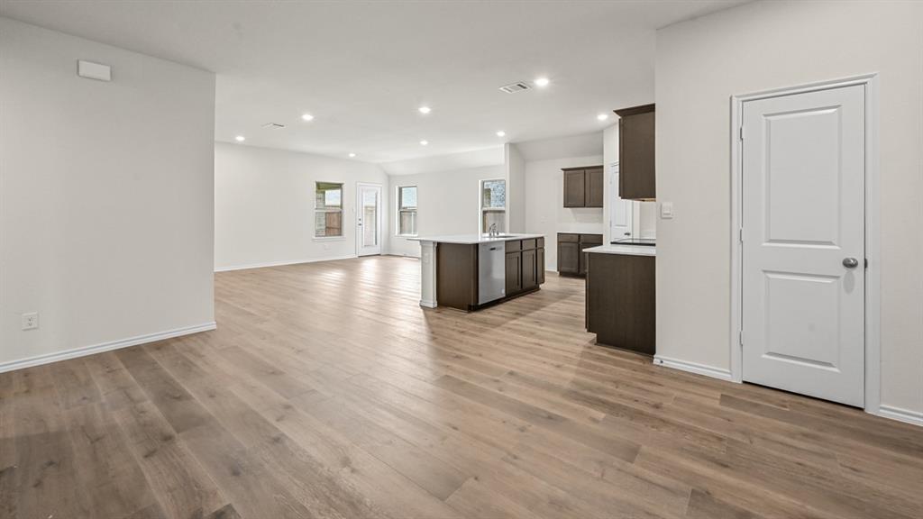 6088 Freedom Drive Lindale, TX 75706 - Photo 10 of 40 a view of kitchen with stainless steel appliances refrigerator microwave and stove