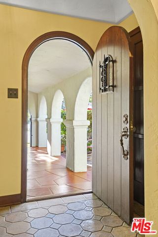 a living room with furniture fireplace and a fireplace