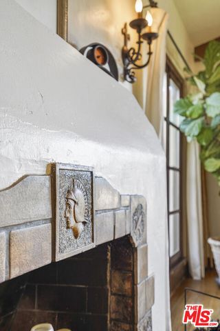 a kitchen with granite countertop a sink and white cabinets
