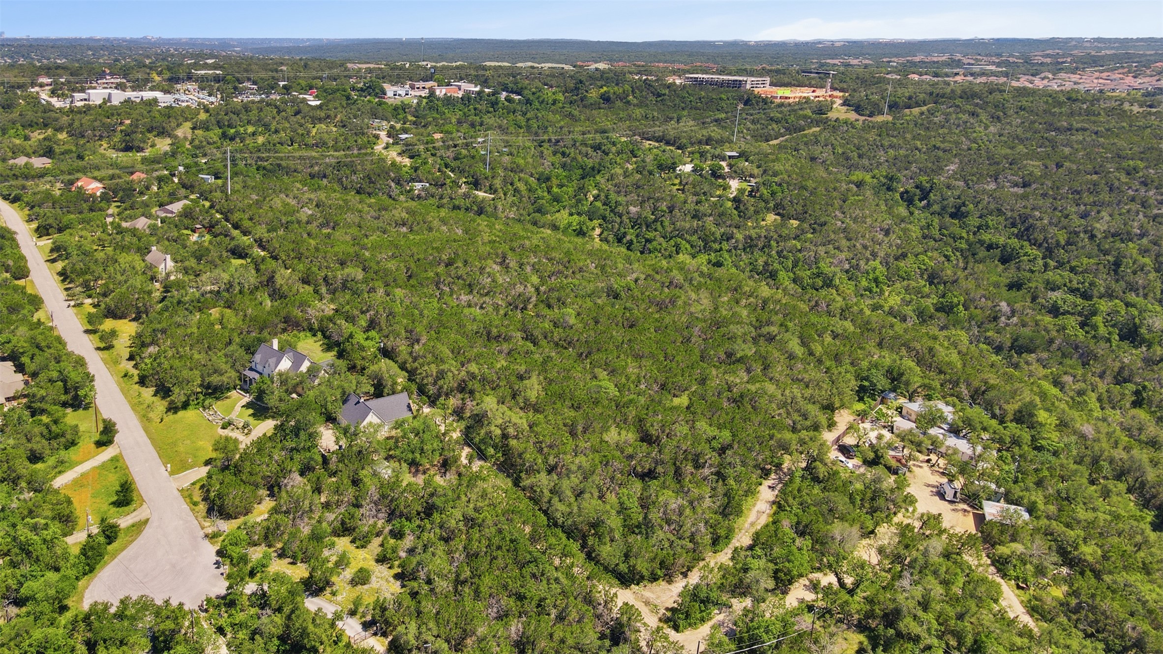 0 North Ranch Road 620 Road Austin, TX 78726 - Photo 8 of 20 an aerial view of residential houses with outdoor space and trees