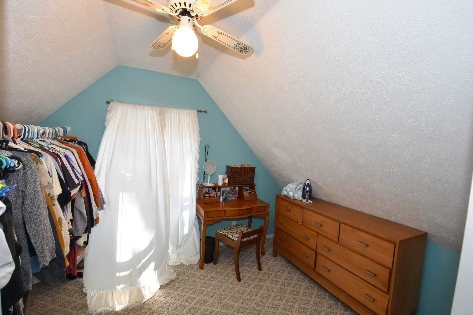 610 North Main Street Le Roy, IL 61752 - Photo 19 of 22 a bedroom with a bed and a chandelier