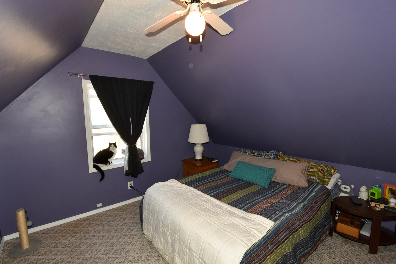 610 North Main Street Le Roy, IL 61752 - Photo 20 of 22 a bed sitting in a bedroom next to a window