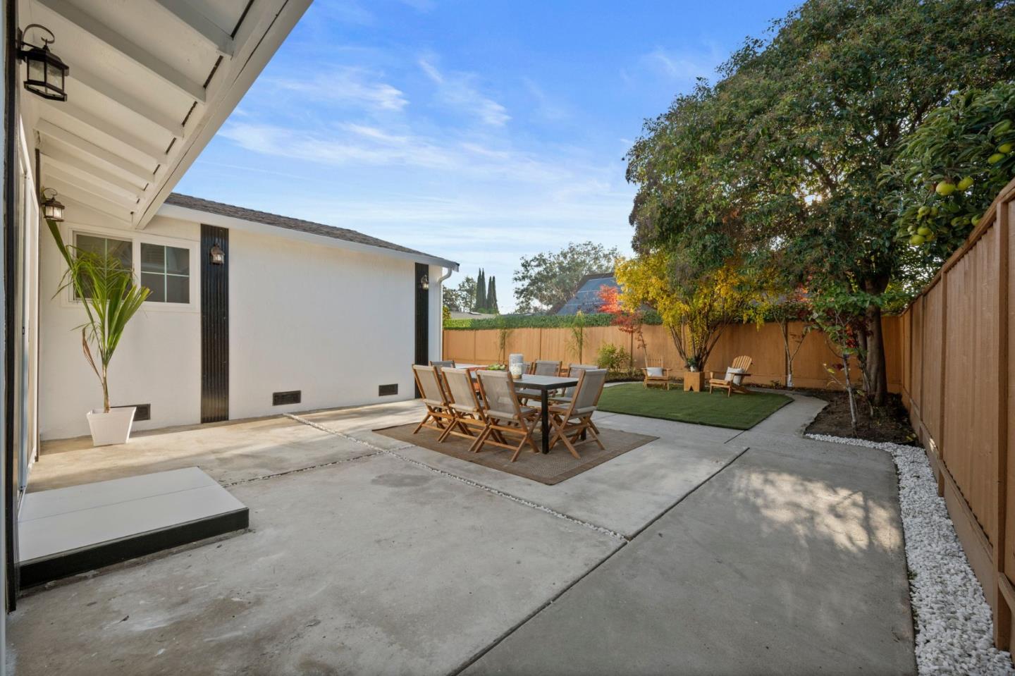 3735 Ruther Pl Way San Jose, CA 95121 - Photo 28 of 38 a view of a backyard with table and chairs and a barbeque