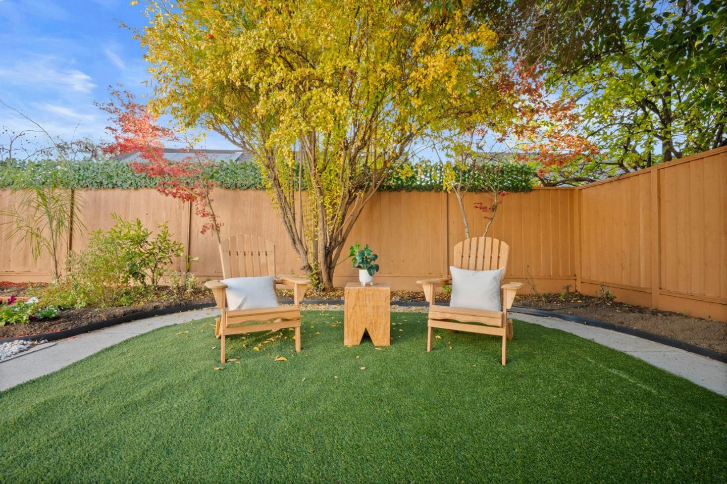 3735 Ruther Pl Way San Jose, CA 95121 - Photo 30 of 38 a backyard of a house with table and chairs