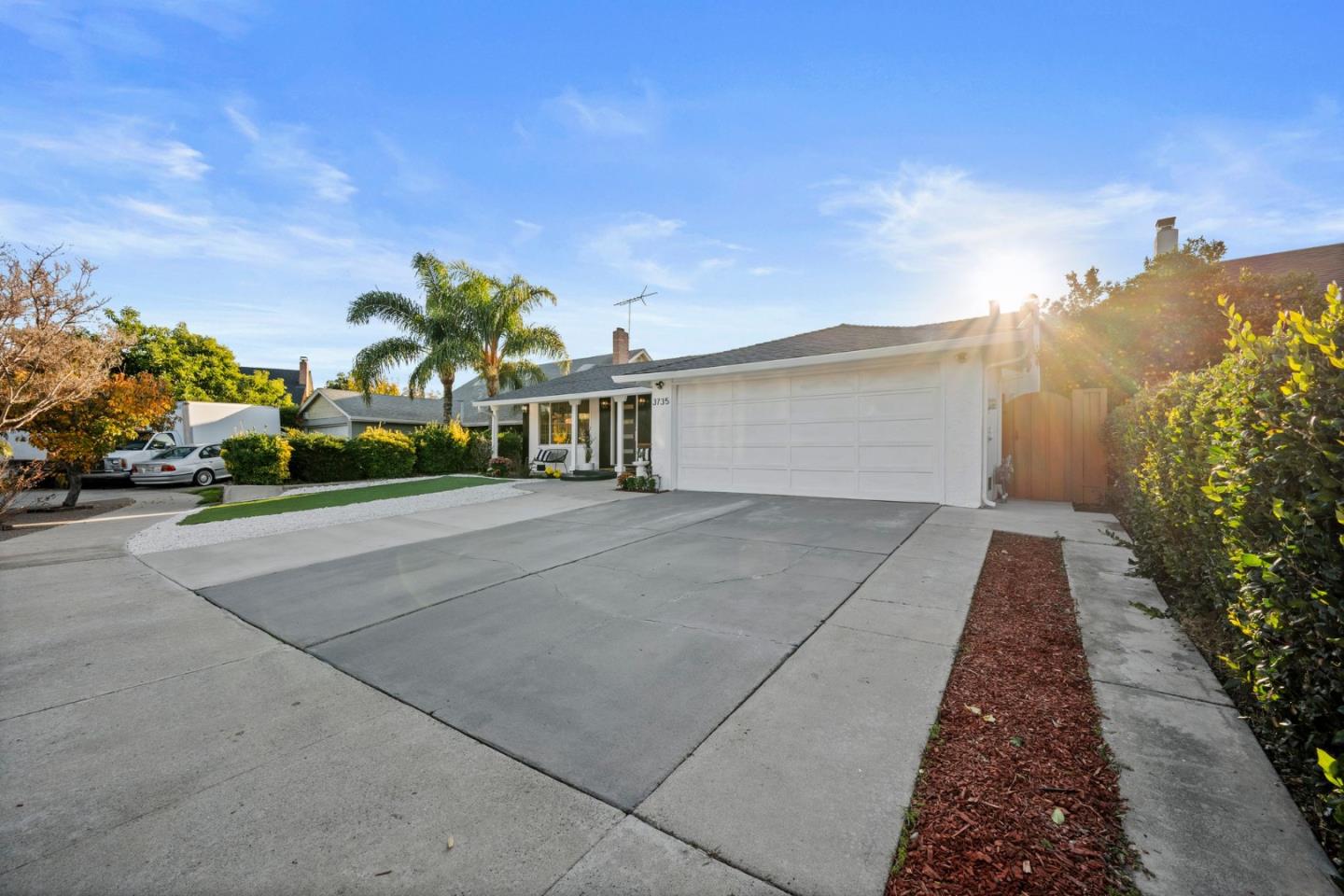 3735 Ruther Pl Way San Jose, CA 95121 - Photo 37 of 38 a view of a building with a yard and car parked