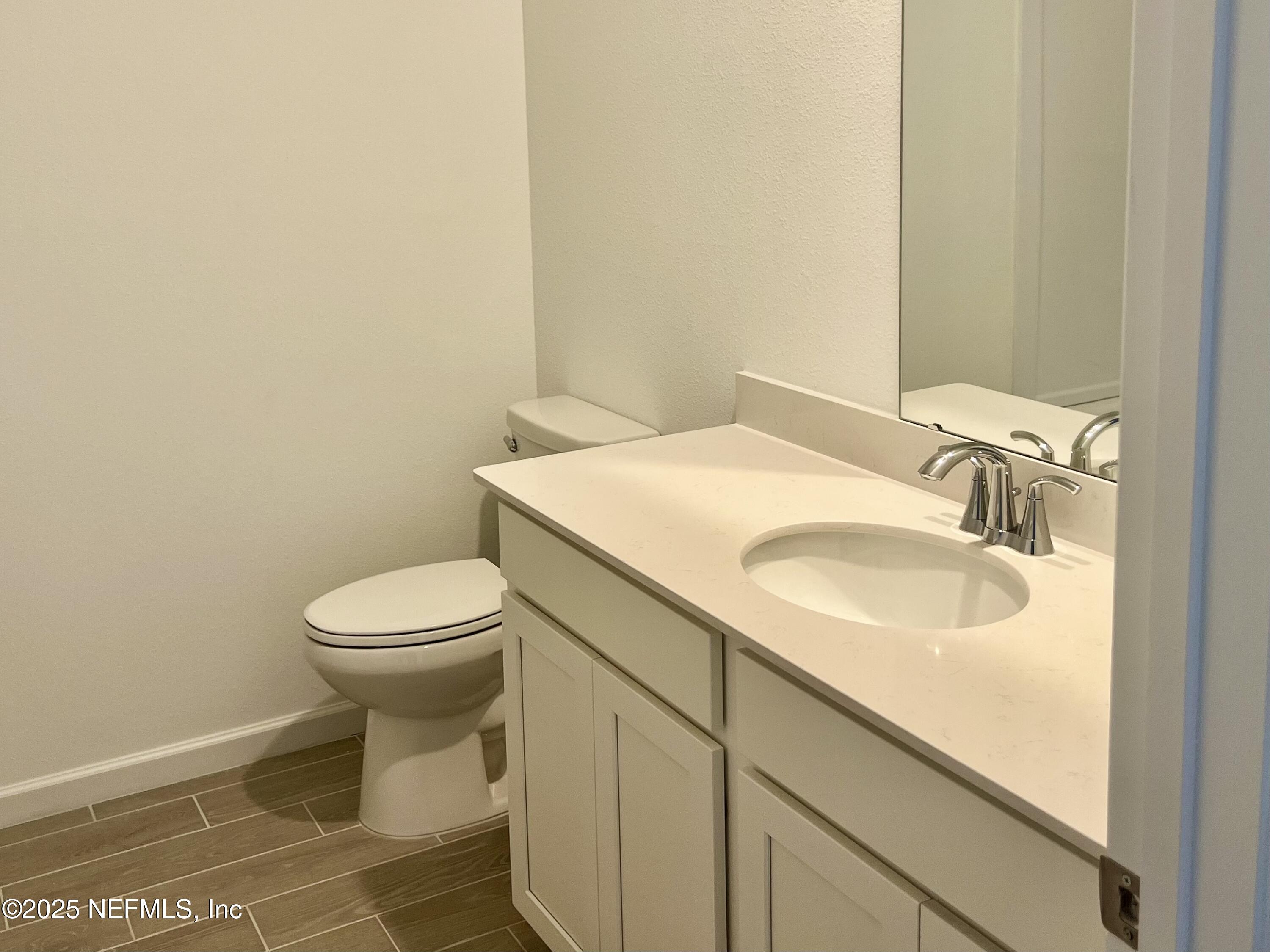 1586 Lachlan Circle Jacksonville, FL 32218 - Photo 12 of 16 a bathroom with a granite countertop toilet and sink