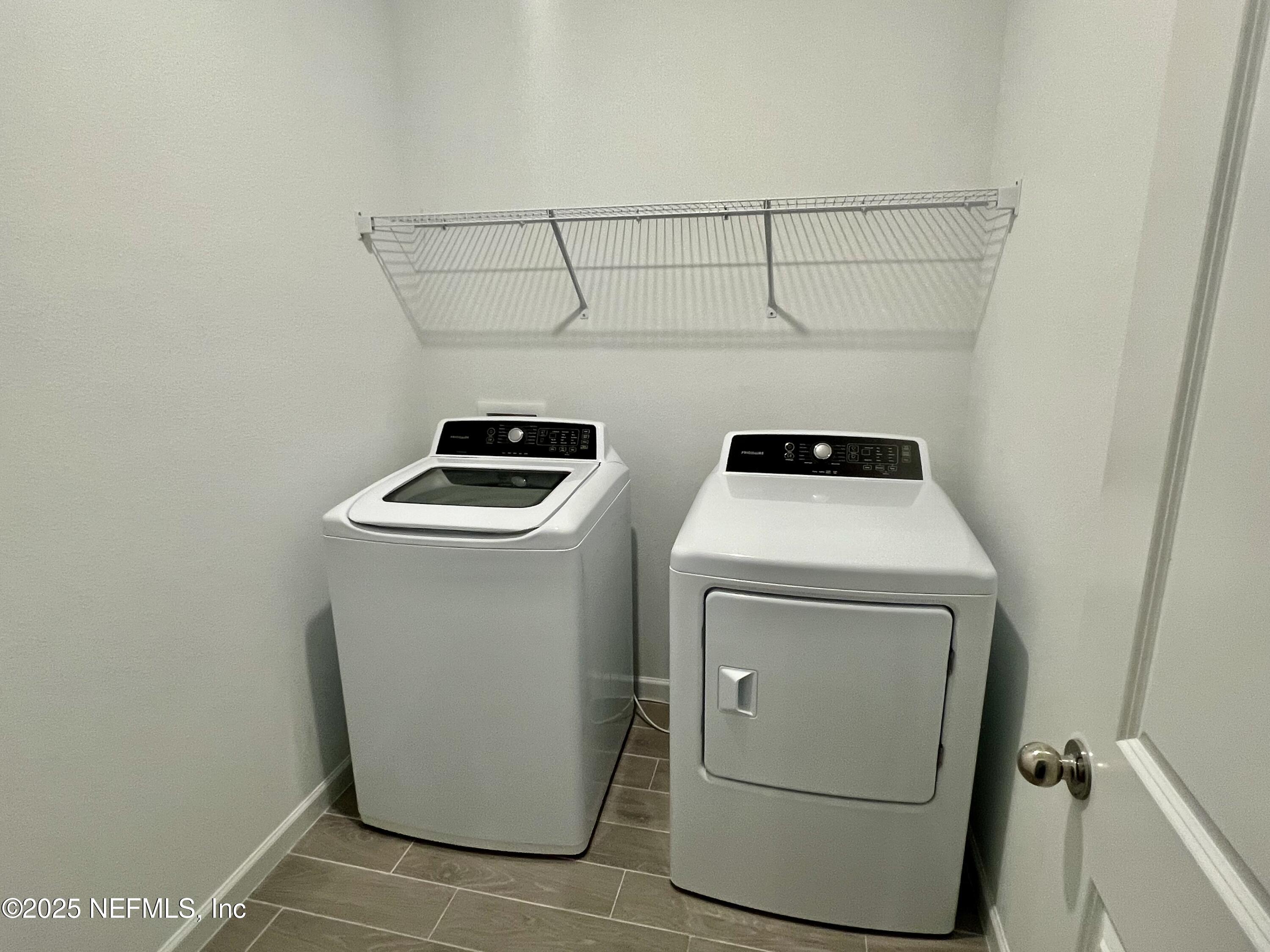 1586 Lachlan Circle Jacksonville, FL 32218 - Photo 14 of 16 a utility room with dryer and washer