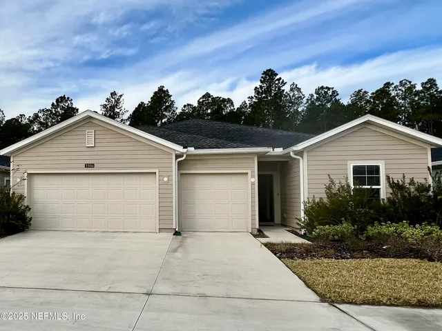 a view of garage and yard