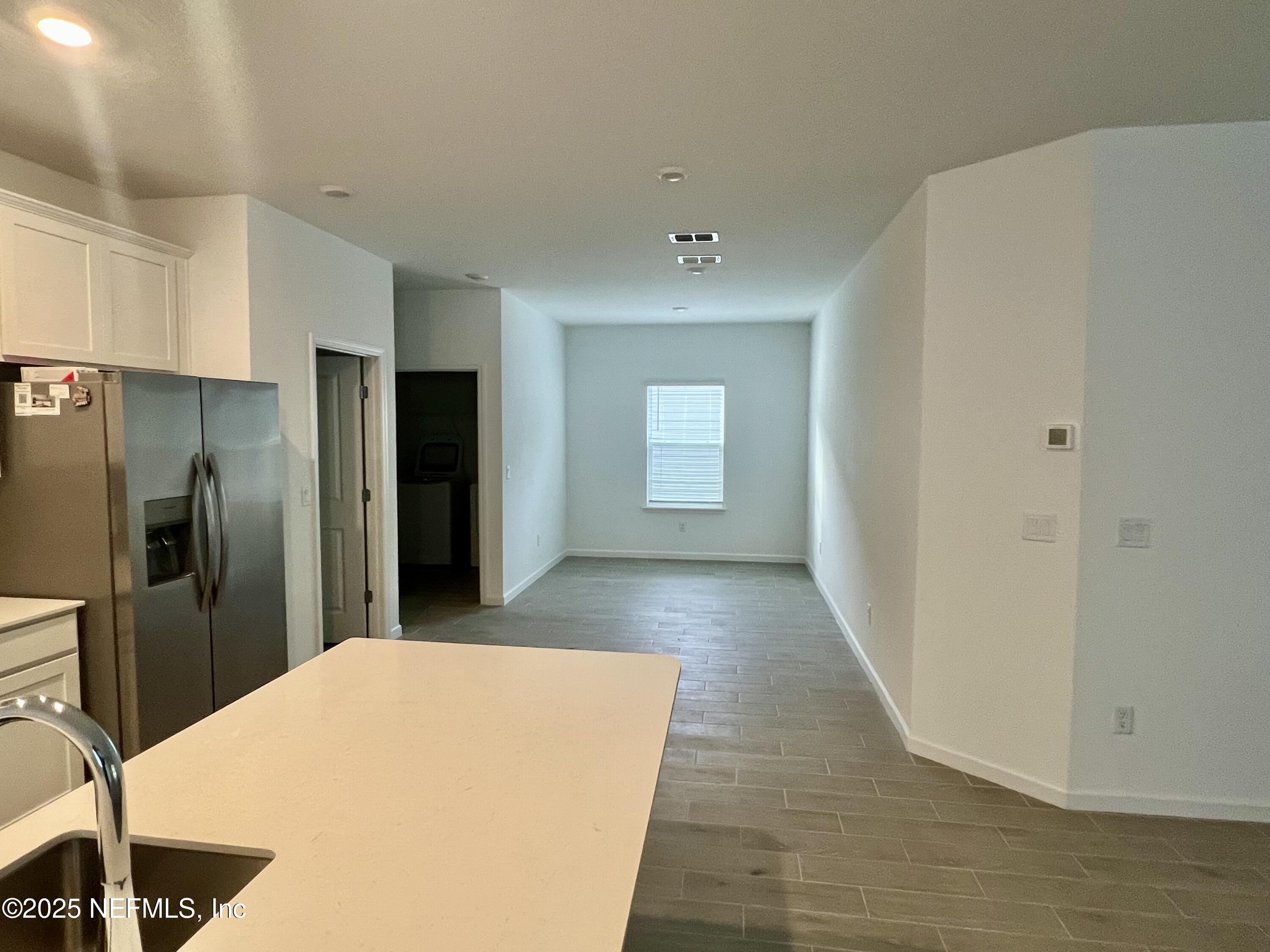 1586 Lachlan Circle Jacksonville, FL 32218 - Photo 5 of 16 a kitchen with stainless steel appliances a refrigerator and a stove top oven