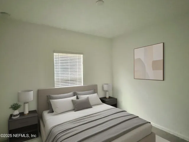 a bedroom with a bed and a window