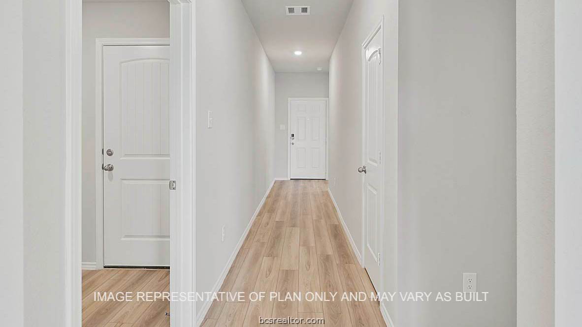 449 Combine Road Snook, TX 77879 - Photo 2 of 18 a view of a hallway with wooden floor and entryway