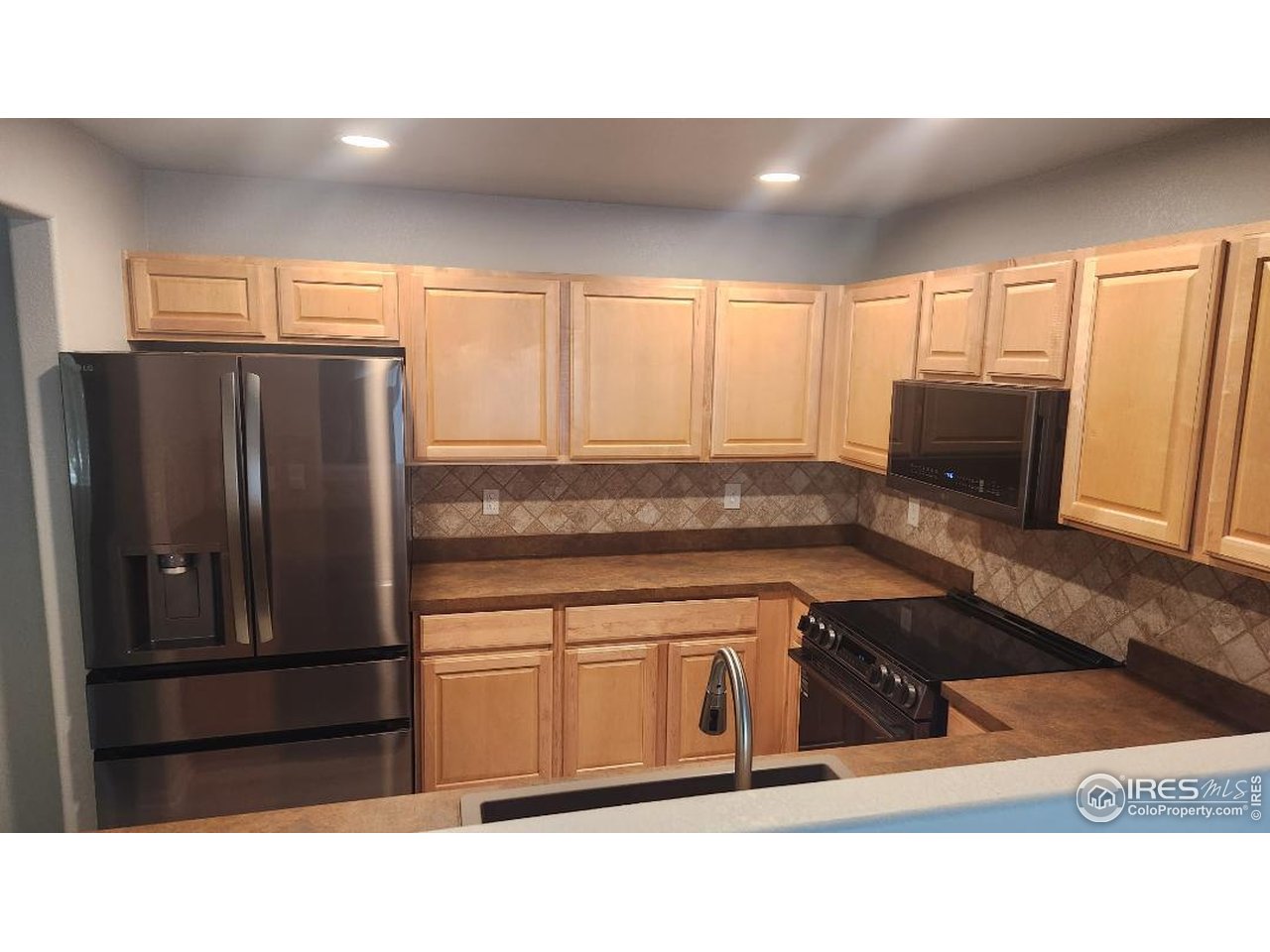 5115 Old Mill Road Fort Collins, CO 80528 - Photo 5 of 41 Gormet Kitchen - New Appliances, sink & floor