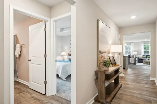 a view of a hallway with living room and furniture