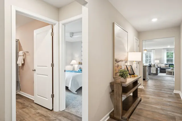 a view of a hallway with living room and furniture