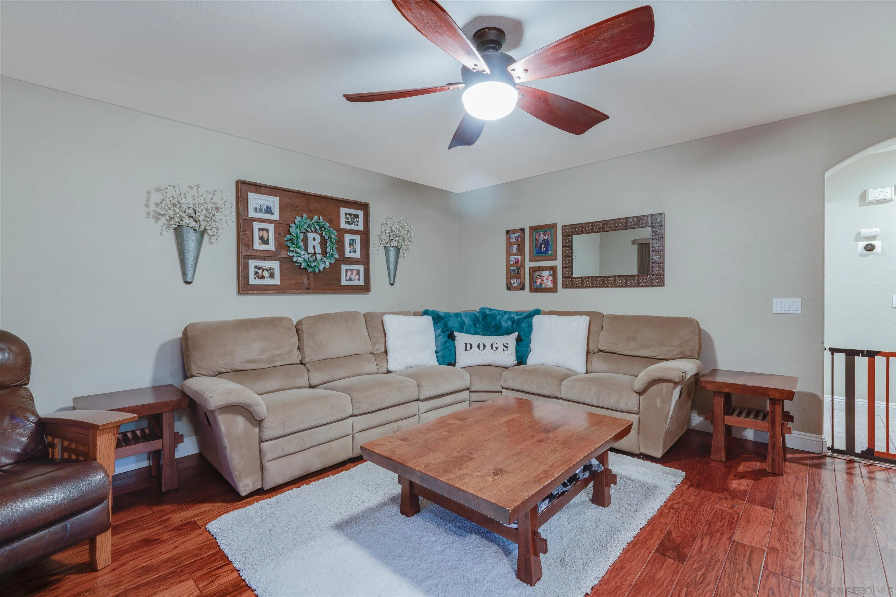 10229 Pinon Place Lakeside, CA 92040 - Photo 14 of 33 a living room with furniture a rug and a chandelier