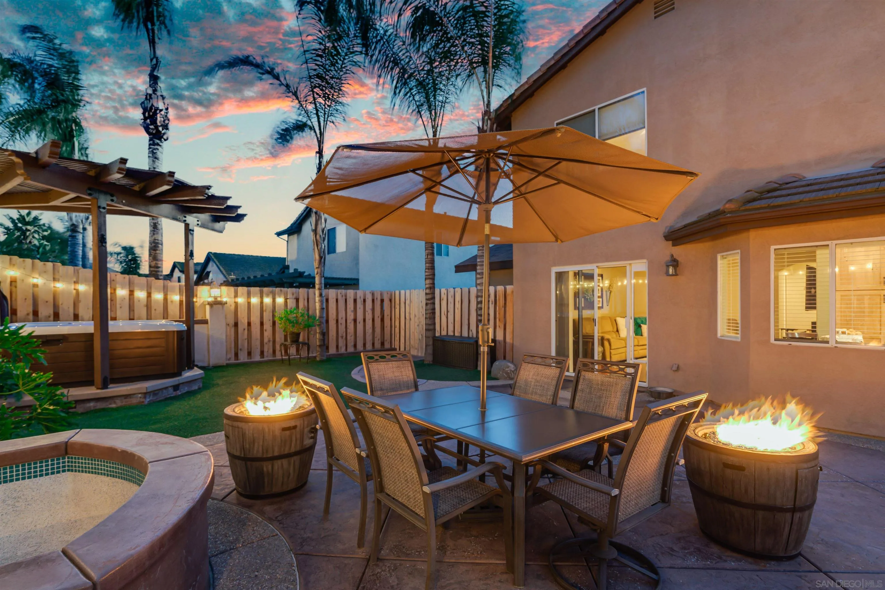 10229 Pinon Place Lakeside, CA 92040 - Photo 19 of 33 a backyard of a house with barbeque oven table and chairs