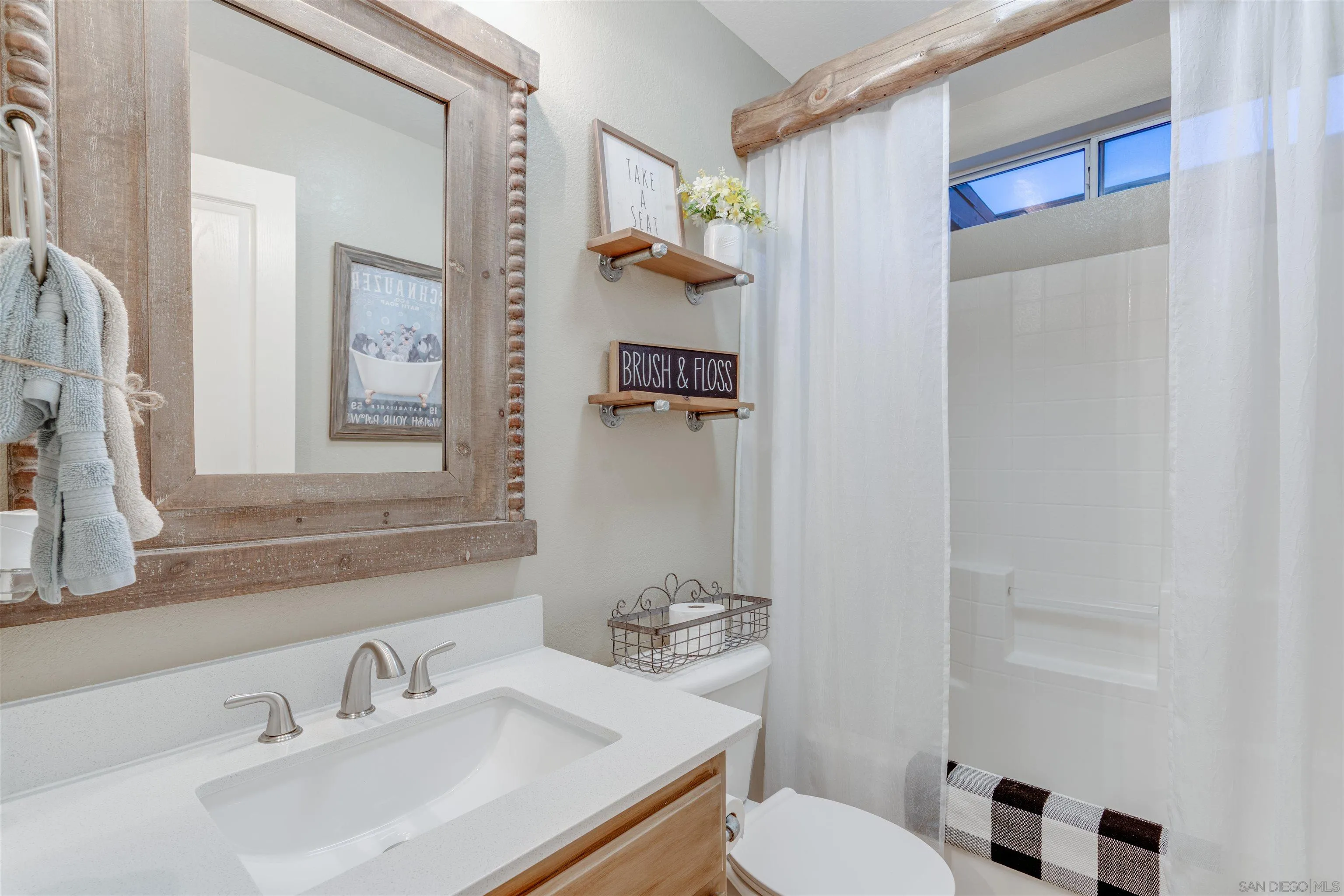 10229 Pinon Place Lakeside, CA 92040 - Photo 26 of 33 a bathroom with a sink toilet and mirror