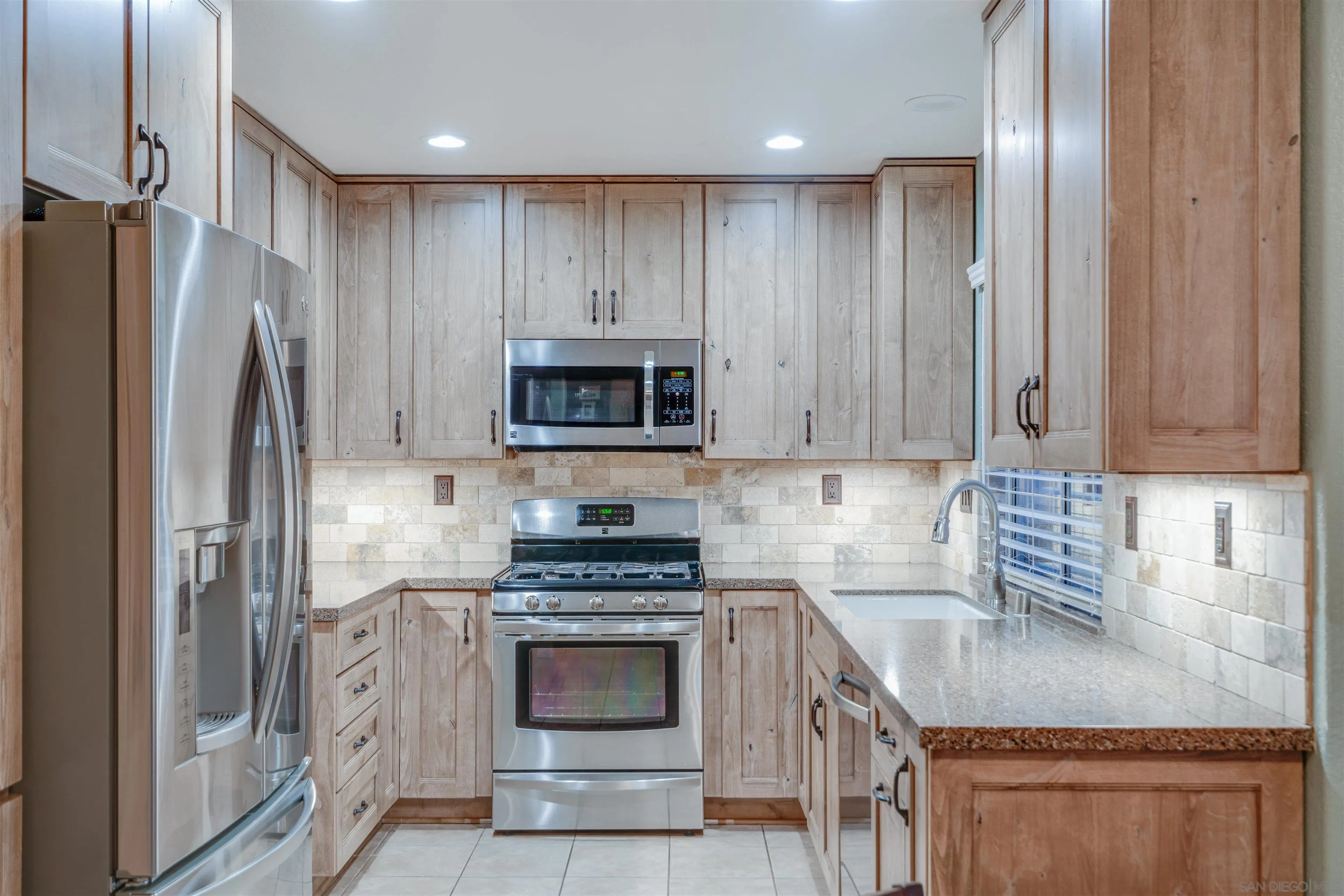 10229 Pinon Place Lakeside, CA 92040 - Photo 9 of 33 a kitchen with a sink stove and refrigerator