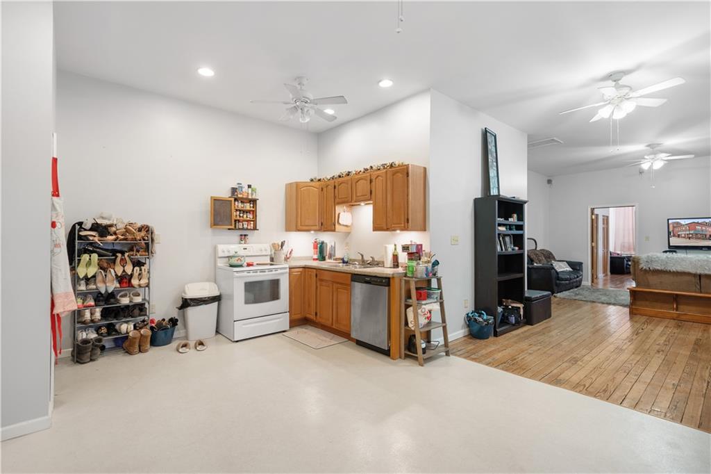 202 West Main Street Monongahela, PA 15063 - Photo 16 of 35 a large white kitchen with stainless steel appliances lots of white cabinets