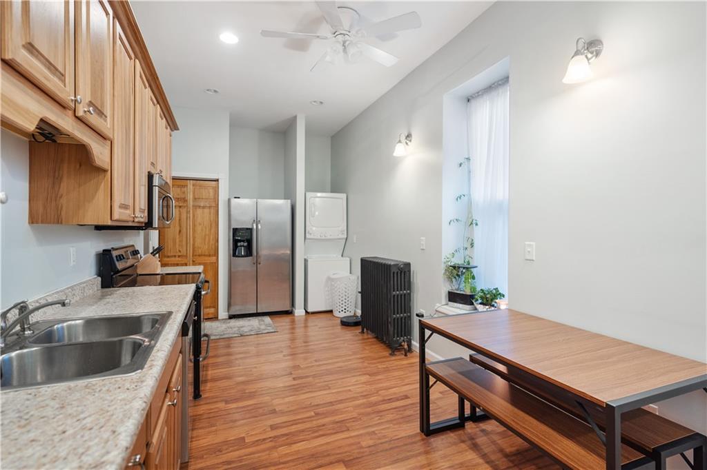 202 West Main Street Monongahela, PA 15063 - Photo 7 of 35 a kitchen with stainless steel appliances granite countertop a refrigerator a sink and a stove