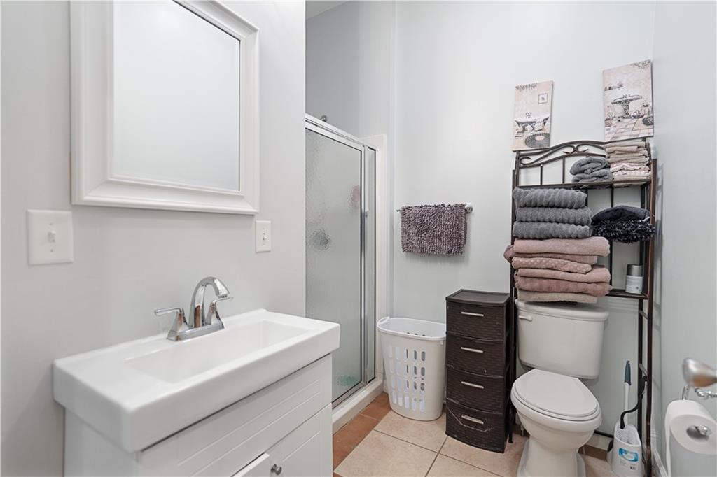 202 West Main Street Monongahela, PA 15063 - Photo 9 of 35 a bathroom with a toilet a sink and mirror
