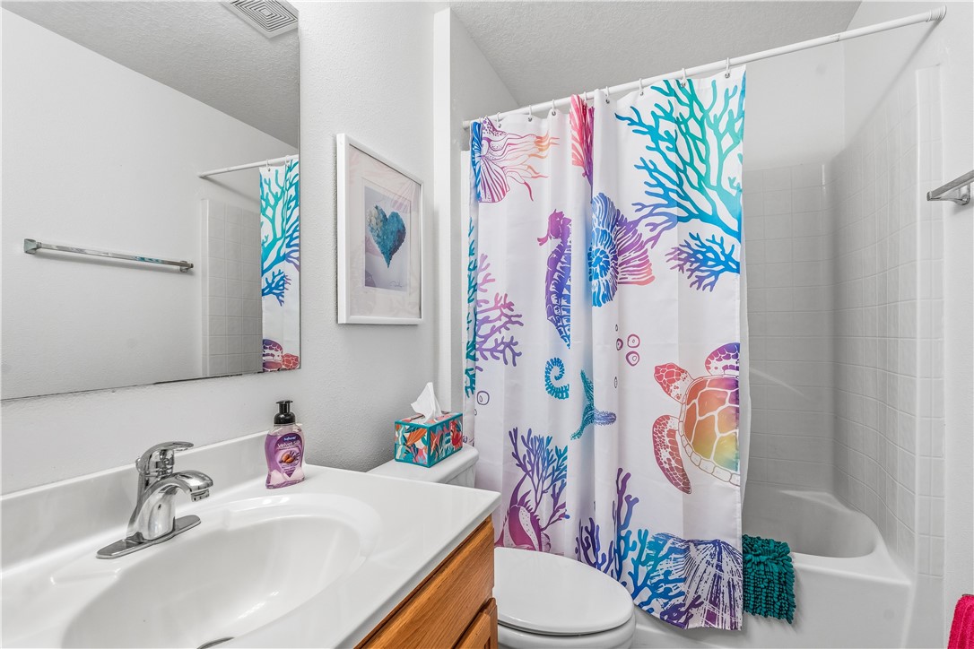 131 Bellamy Trail Sebastian, FL 32958 - Photo 21 of 32 a bathroom with a sink mirror vanity and toilet