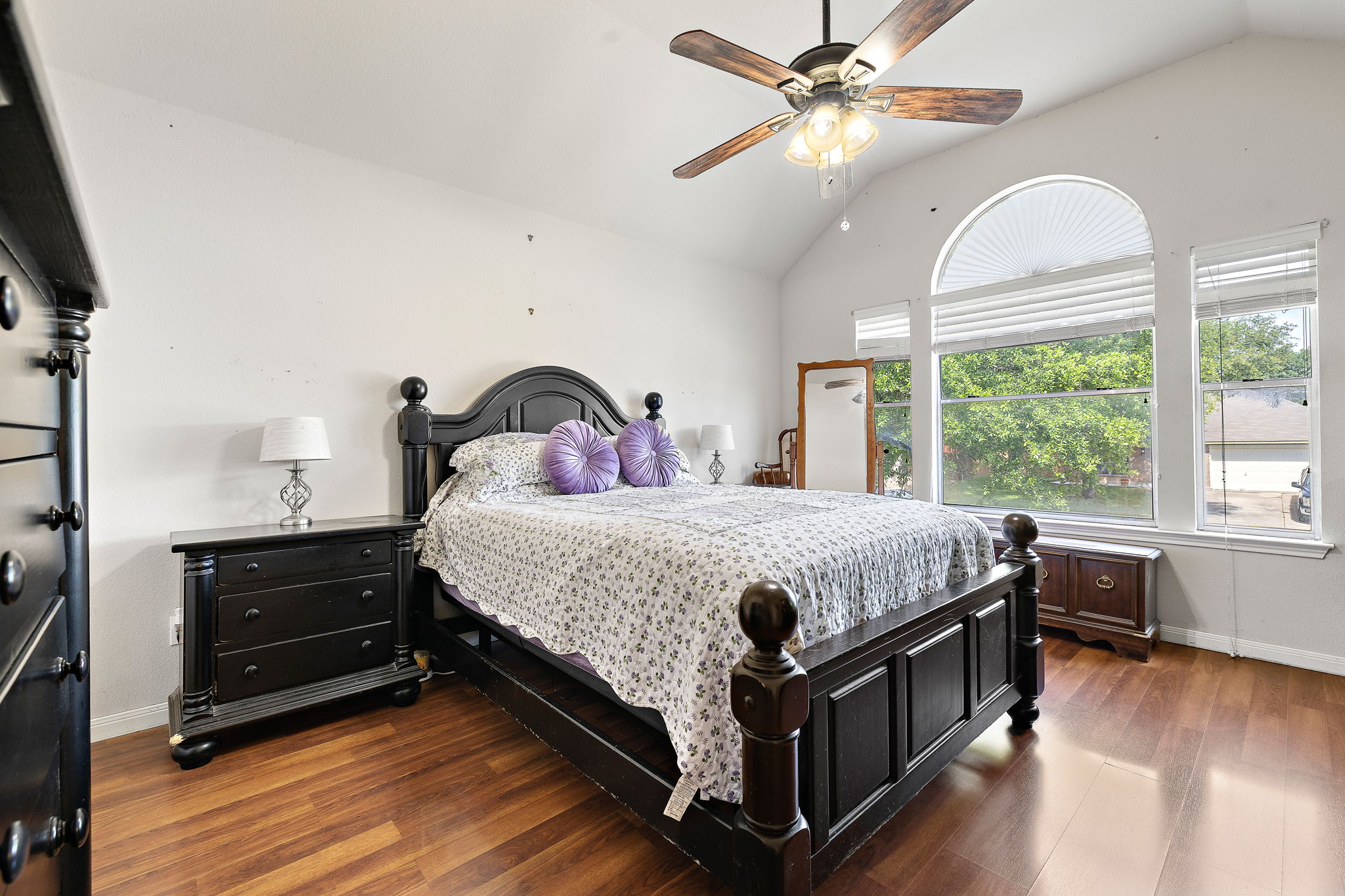 615 Runners Ridge Pflugerville, TX 78660 - Photo 19 of 32 a bed room with a bed and a chandelier
