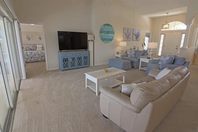 a kitchen with kitchen island a sink stove and refrigerator