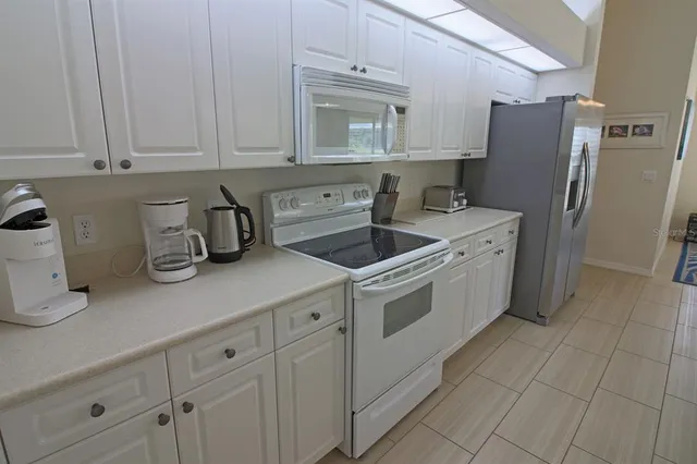 a spacious bathroom with a sink a mirror and a bathtub