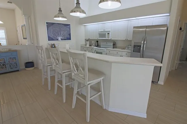 a bed room with a bed and a chair