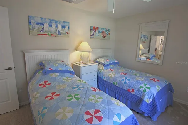 a view of a patio with a table chairs and a yard