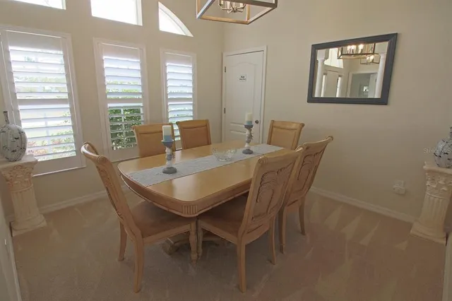 a view of a chair and tables in the patio