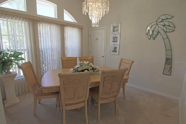 an aerial view of a house with a lake view